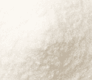 Close-up of a white powdery substance on a light beige background